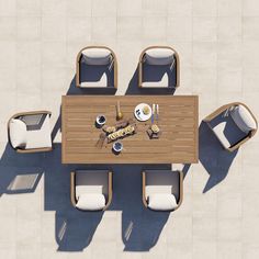 an overhead view of a table and chairs with food on it