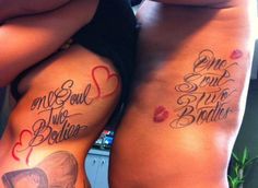 two women with matching tattoos on their stomachs