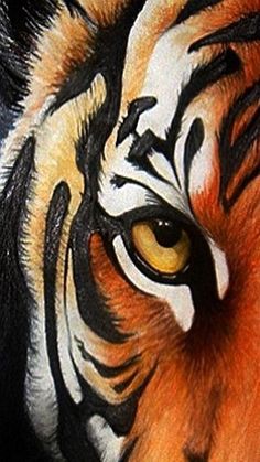 a tiger's face with yellow eyes and black stripes