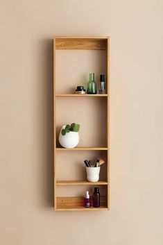 a wooden shelf with various items on it