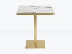 a white marble table with gold metal base on a plain grey background in the shape of a square