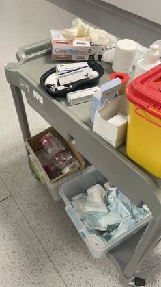 the cart is full of medical supplies on the floor