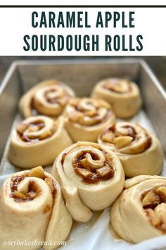 homemade caramel apple sourdough rolls in a baking pan with text overlay