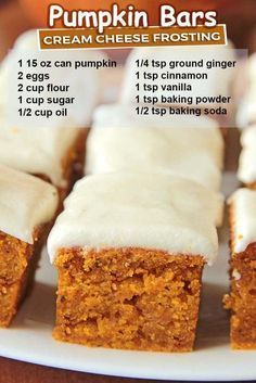 pumpkin bars with cream cheese frosting on a white plate