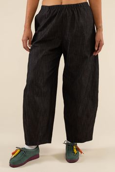 Our signature Lantern Pant is now available in Black! It features this same fit with a high-waist and elastic at waist for max comfort. These pants effortlessly give a "raw denim look" without the stiffness, heaviness, and lack of stretch. They retain their shape while being soft, stretchy, and comfortable to wear - making it the perfect alternative to traditional raw denim. High-waisted fit 1" elastic waist Side pockets Locally sourced Washed Lightweight Denim Cut and sewn ethically, in-house a High Waist Relaxed Fit Pull-on Jeans, Washed Black Cropped Leg Pants With Five Pockets, Washed Black Relaxed Fit Pants With Elastic Waistband, Relaxed Fit Straight Pants In Washed Black, Relaxed Fit Washed Black Straight Bottoms, Washed Black Relaxed Fit Straight Bottoms, Washed Black Relaxed Fit Straight Pants, Black Denim Wide Leg Pants With Pockets, Black Denim Wide Leg Pants For Fall