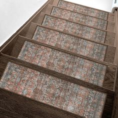 a tall building with carpeted steps leading up to the top