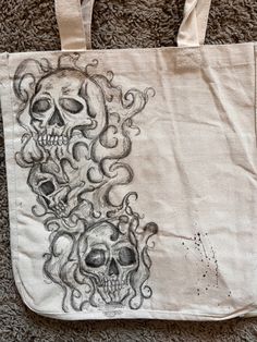 a tote bag with two skulls on it