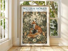 an image of a fox and its cub in front of a window with the words william morris on it