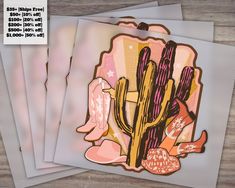 three cards with cactus designs on them sitting next to each other in front of a wooden table