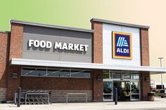 an aldi food market is shown on the side of a building with its doors open