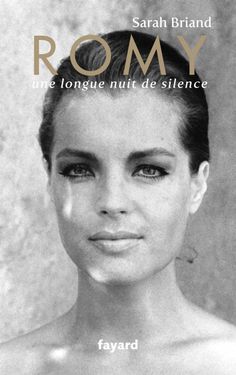 a black and white photo of a woman's face with the words romy on it