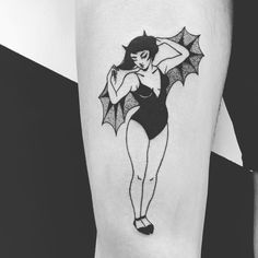 a woman in a bathing suit holding an umbrella tattoo on her leg and the arm