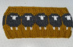 a knitted object with sheep on it