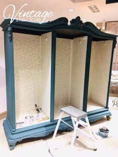 an old fashioned blue and white dressing table with two mirrors on it's sides