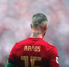 a soccer player with tattoos on his back