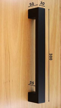 an image of a door handle on a wooden surface with measurements for the number one