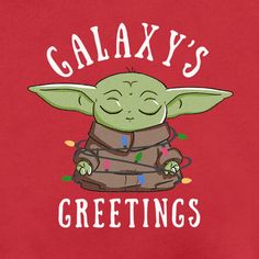 a red shirt with an image of a baby yoda sitting on top of it