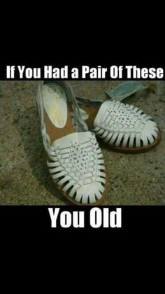 a pair of white shoes sitting on top of a floor