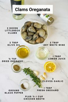 clams, lemons and other ingredients on a white marble counter top with the words clams organata