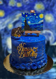 a blue birthday cake decorated with an image of the starry night painting on it