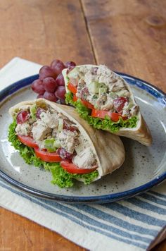 two wraps filled with meat and veggies on a plate