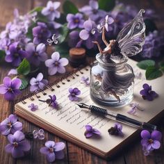 a fairy figurine sitting on top of a glass jar filled with purple flowers