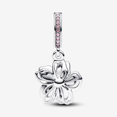 Celebrate the first signs of spring with our sterling silver Cherry Blossom Dangle Charm. Featuring hand-applied pink and white enamel and accented by sparkling pink cubic zirconia, the petals on our cherry blossom rotate slightly, as if they were being blown in the breeze. A pavé-covered bail is the finishing touch on this must-have floral charm. Style it with other cool-toned jewellery for a warm spring look. - Pandora Cherry Blossom Dangle Charm - Enamel / Sterling silver / Cubic Zirconia / P