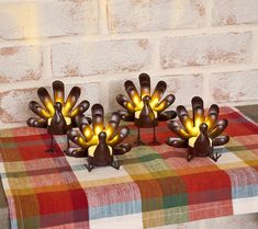 three decorative lights are sitting on a table