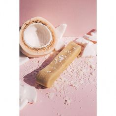 a piece of bread sitting on top of a pink surface