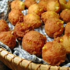 a basket filled with fried food on top of a table