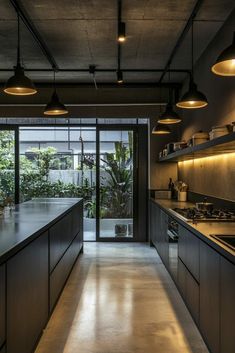 a kitchen with lots of counter space and lights