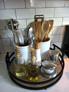 kitchen utensils are arranged on a tray