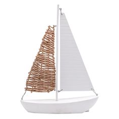 a white boat with a brown sail on it's side and a wicker sail