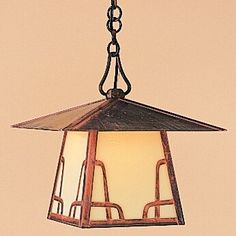 a light hanging from a ceiling in a room