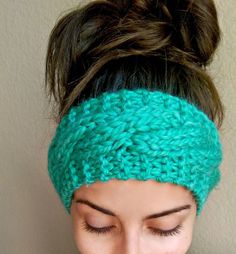 a close up of a woman wearing a headband