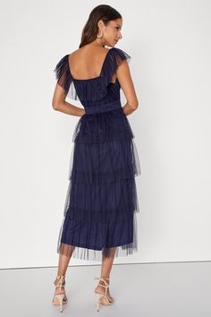 Make an entrance that everyone will love in the Lulus Tier I Come Navy Blue Tulle Square Neck Tiered Midi Dress! Airy tulle shapes this oh-so-sweet dress that features a square neckline, accented by a tying keyhole cutout and a flouncy overlay that flows into fluttery, elasticized straps. Slightly gathered bodice sits atop an elasticized, smocked waist that falls to a tiered skirt that ends at a midi hem. Hidden side zipper/clasp. Fit: This garment fits true to size. Length: Mid-calf length. Siz Chic Blue Mesh Dress For Spring, Blue Sheer Midi Dress For Party, Chic Tulle Midi Dress For Summer, Chic Blue Mesh Dress For Evening, Sleeveless Tulle Midi Dress With Ruffles, Summer Tulle Midi Dress With Ruffles, Summer Cocktail Tulle Midi Dress, Summer Midi Dress With Ruffles In Light Fabric, Blue Tiered Tulle Dress