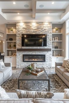 a living room filled with furniture and a flat screen tv mounted on the wall above a fire place