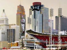 a city skyline with tall buildings and a statue in the foreground that has a man on it