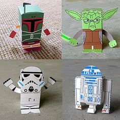 four different star wars paper toys on the ground