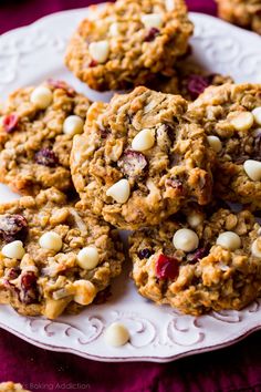 oatmeal cookies with cranberries and white chocolate chips on a plate