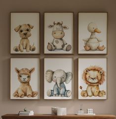 four pictures of animals are hanging on the wall above a dresser in a child's room