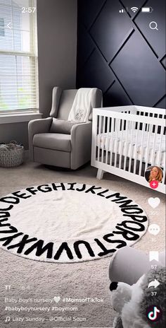 a baby's room with a white crib and black wall