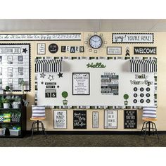 a classroom wall decorated in black and white with pictures on the front, back and sides