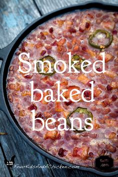 a cooked baked beans pizza in a pan with the words smoked baked beans on it