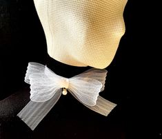 Flower bow choker is a trendy and chic accessory that adds a touch of elegance to any outfit. It can be worn with formal attire to enhance an elegant evening look or paired with casual outfits to add a touch of sophistication. Whether dressing up for a special event wedding, party..) or looking to elevate everyday wear, the organza choker with a bow offers a charming and eye-catching detail to complete the ensemble. Materials: velvet / organza Velvet choker: width: 20mm / 0.8 inches. Size: 29-36cm/ 11-14 inches adjustable length.  Closure: adjustable clasp Bow Size: 170x170mm / 7x7 inches.  Color: available in more colors  *Custom colors or sizing welcome - please message me prior to ordering. *Optional: matching bracelet, hair accessories, please write to create a unique set suitable for Elegant White Bow With Ribbon, Elegant White Ribbon Bow, White Bow For Spring Party, White Ribbon Bow For Spring, Formal White Bow, White Spring Party Bow Tie, Formal White Bow Tie With Ribbon, White Satin Bow For Evening, Elegant White Bow Tie For Wedding