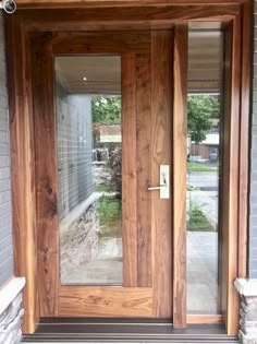 a wooden door with glass on the outside