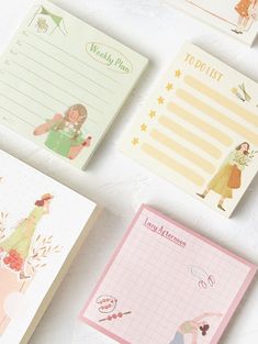 four notepads with different designs on them