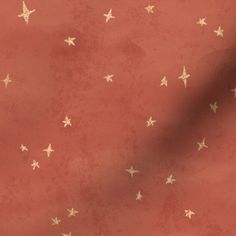 a red background with gold stars on it