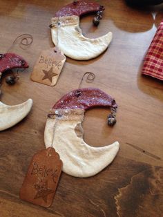 three pieces of food shaped to look like the moon and stars are sitting on a table