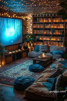 a living room filled with lots of furniture and bookshelves covered in fairy lights